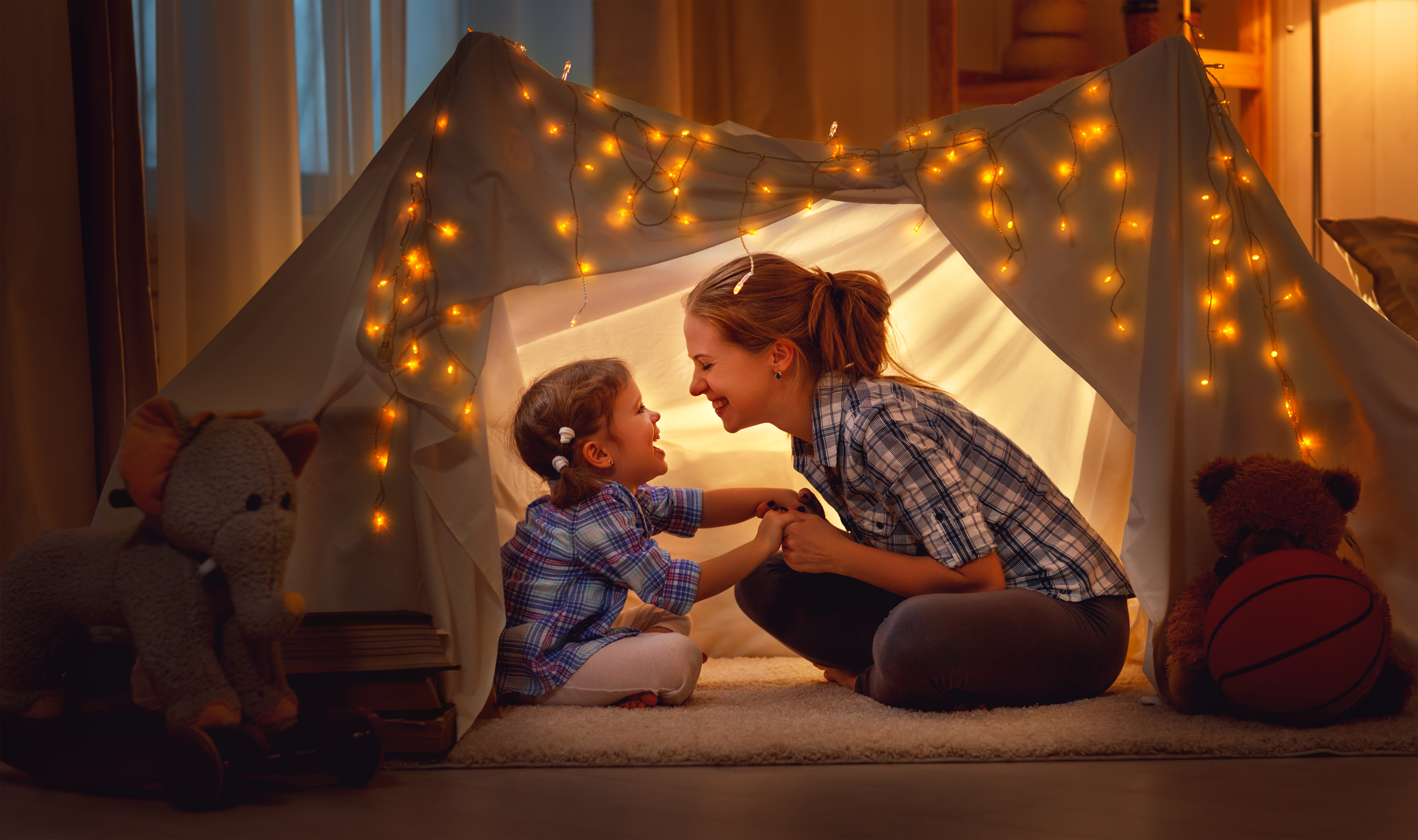 kid and mom in blanket fort